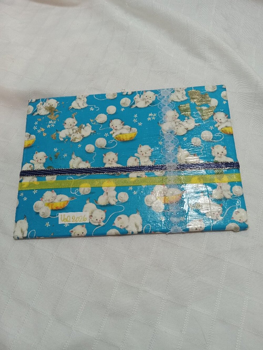A delicate, handmade canvas made from thin vintage wrapping paper